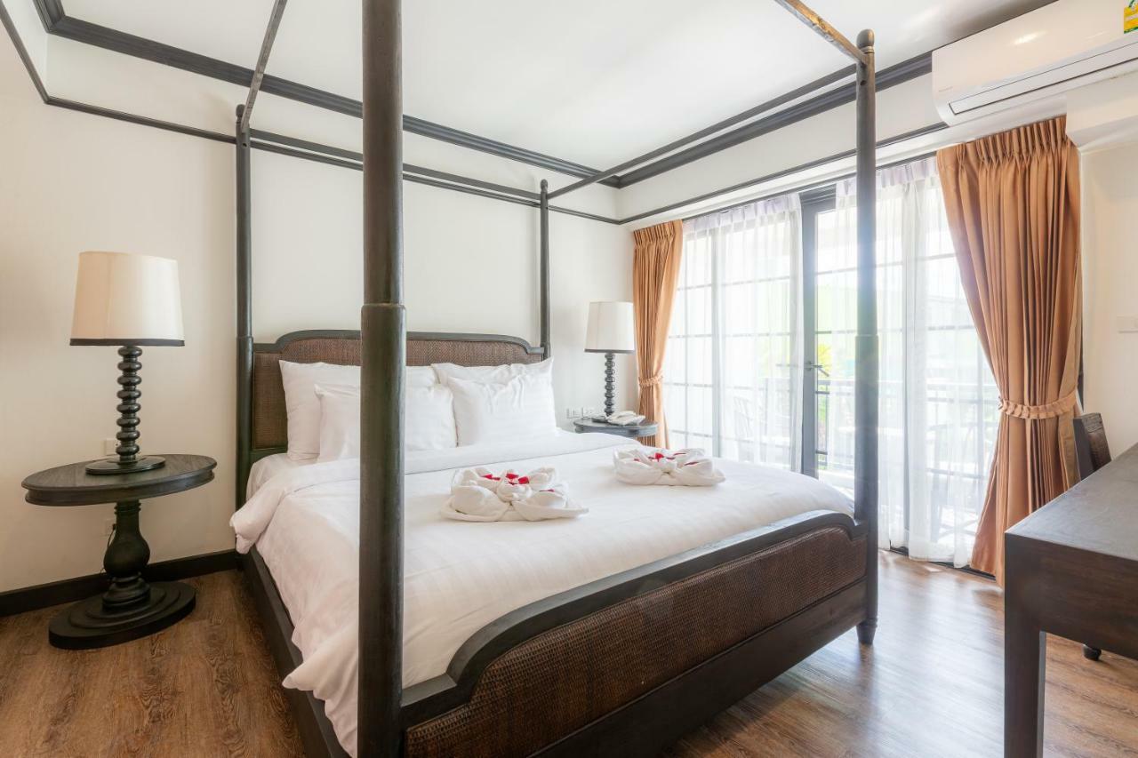 모라 부티크 호텔  치앙라이 외부 사진 A four-poster bed